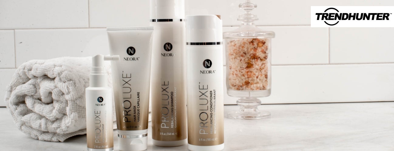 Image of the ProLuxe Hair Care System, including Scalp Treatment, Hair Mask, Conditioner and Shampoo, in a bathroom setting.