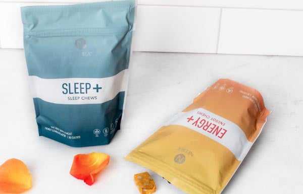 Lifestyle shot of the Sleep+ Energy+ Wellness Chews Combo on a white counter.