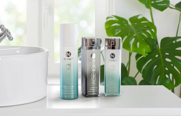 Lifestyle shot of the day, night and cleanser combo sitting on a sunlit bathroom counter.