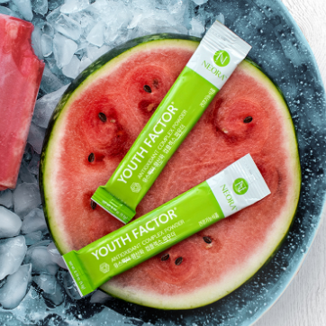 Neora Youth Factor® Superfood & Antioxidant (Powder) pictured with watermelon